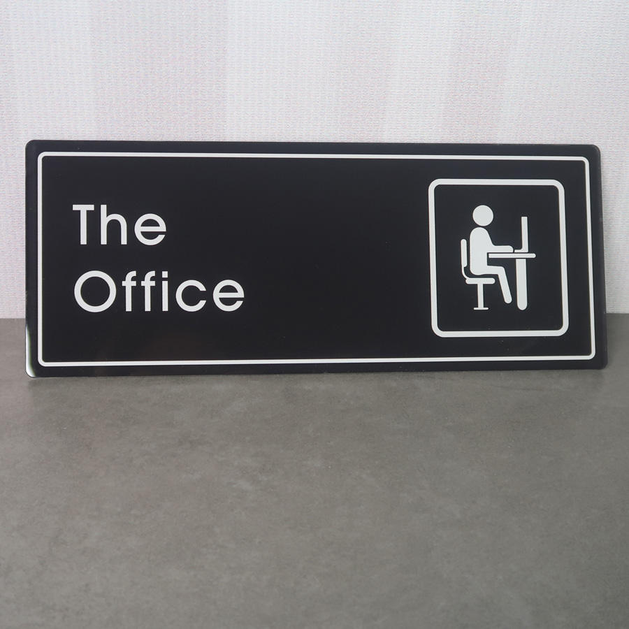 Close-up of Modern Matte Black Office Signage by Lush Global